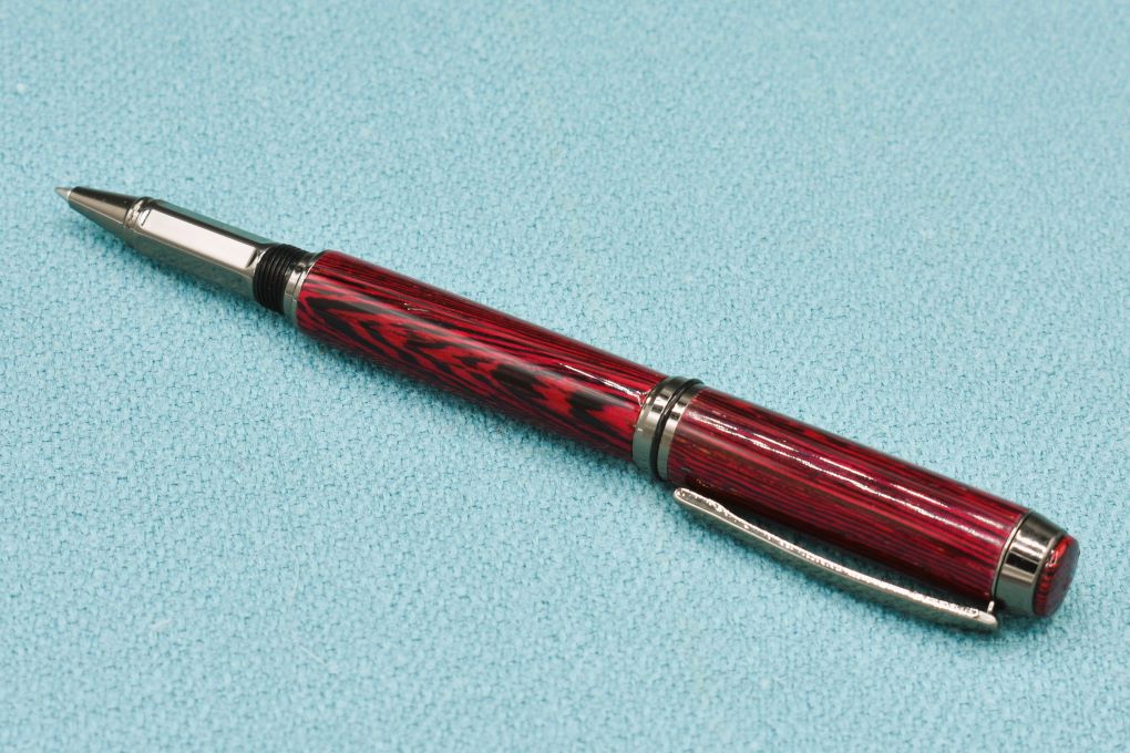 Handmade Thick rollerball pen. Wenge wood dyed red.