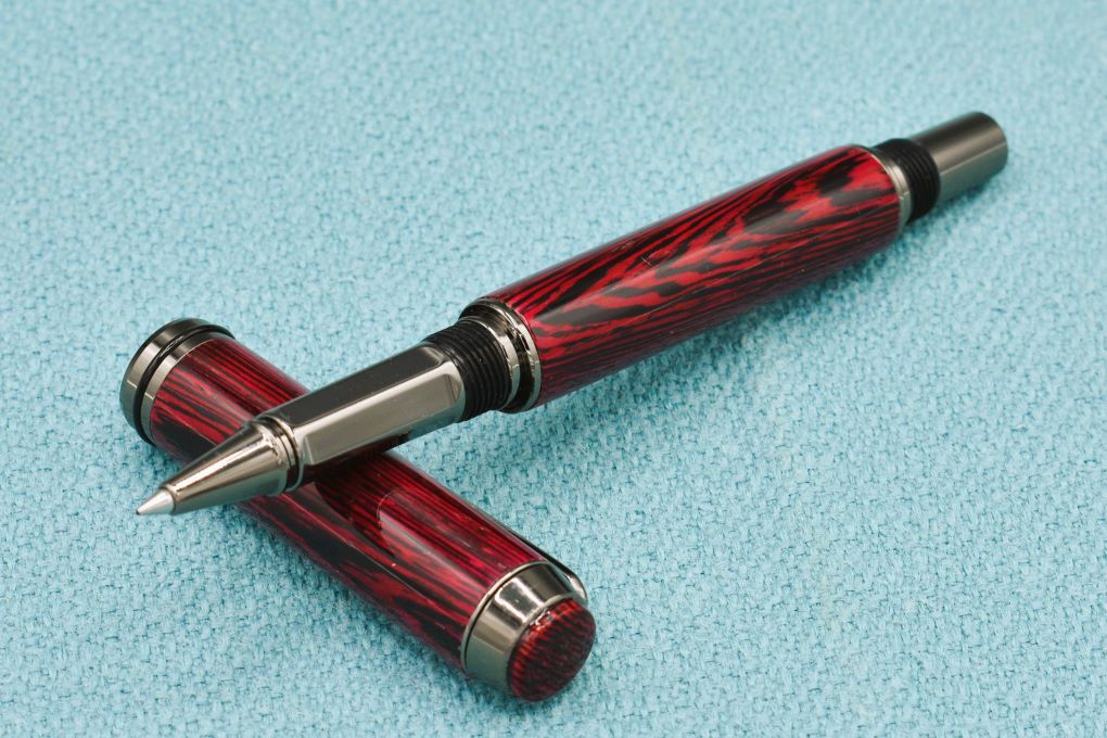 Handmade Thick rollerball pen. Wenge wood dyed red.