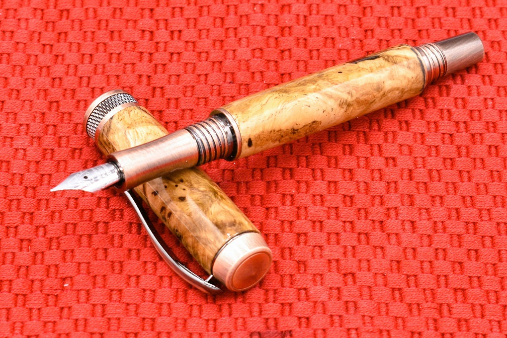 Handmade Knurl Fountain pen in Oak Burl wood.