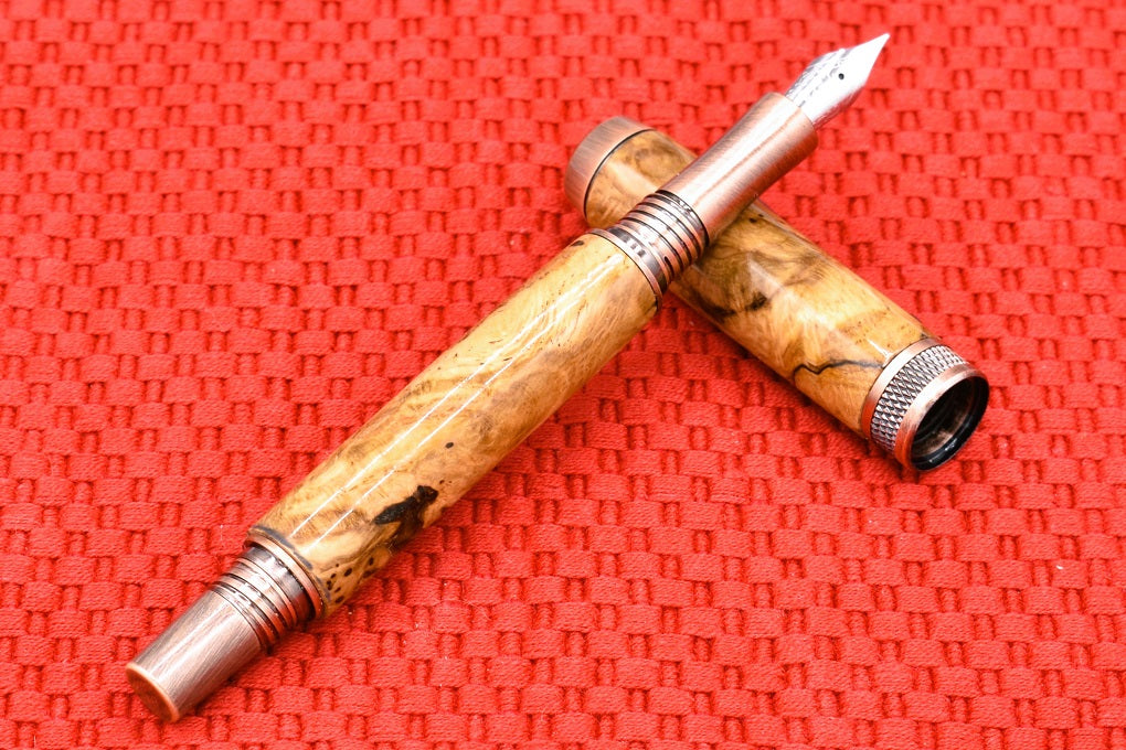 Handmade Knurl Fountain pen in Oak Burl wood.