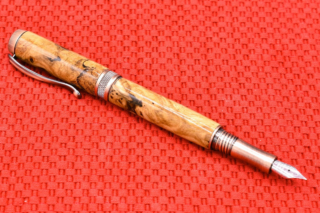 Handmade Knurl Fountain pen in Oak Burl wood.