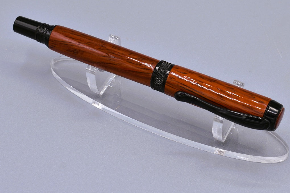 Handmade Knurl rollerball pen. Padauk wood.
