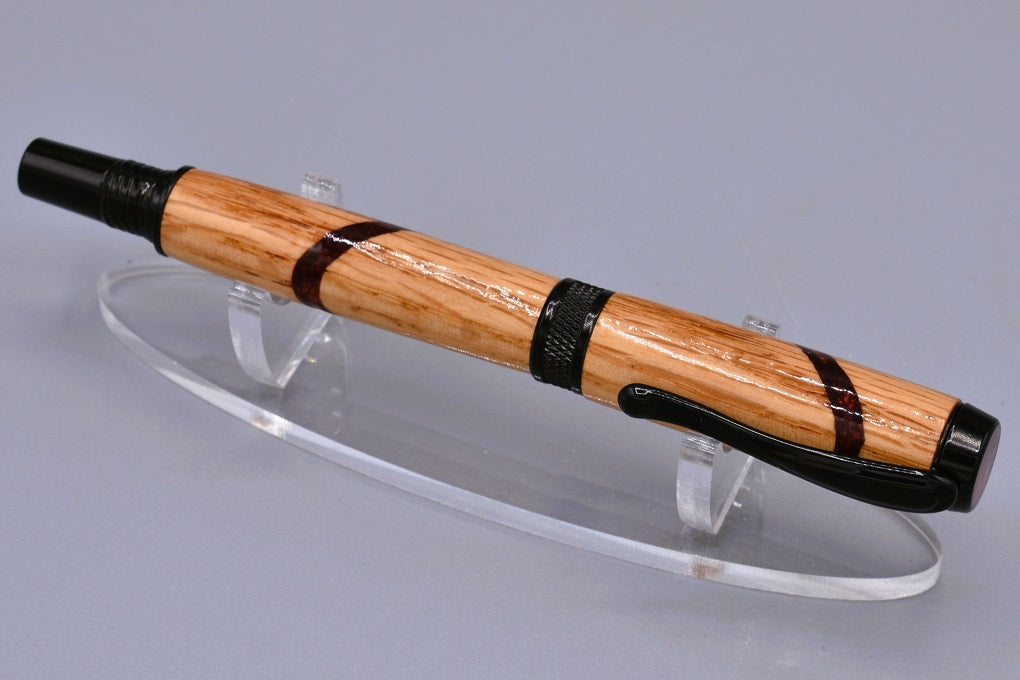 Handmade Knurl rollerball pen. Oak wood and red resin.