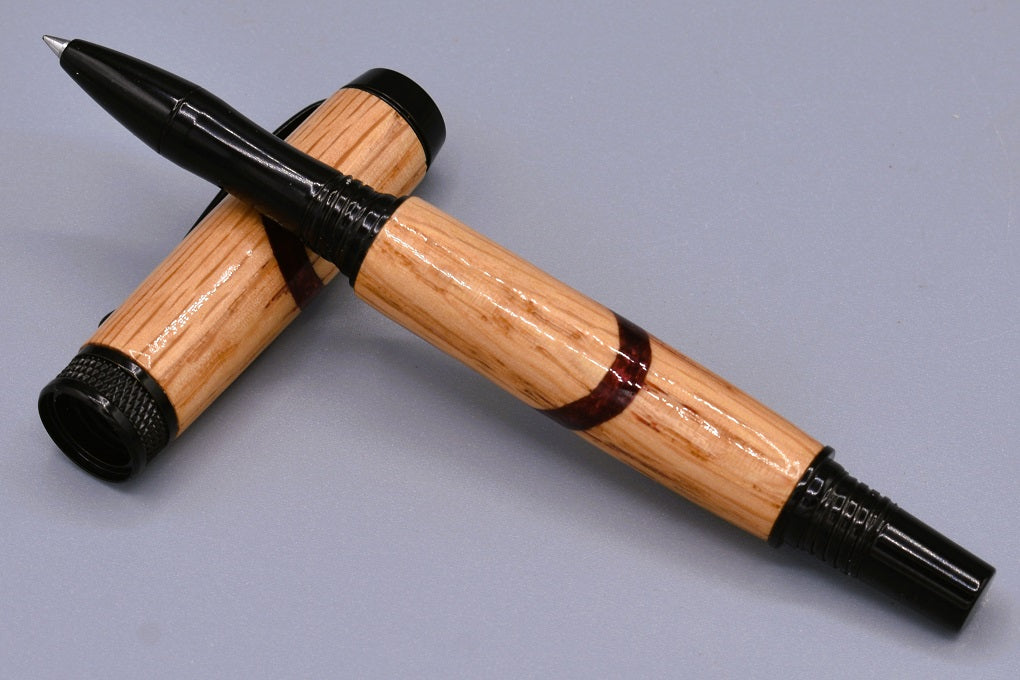 Handmade Knurl rollerball pen. Oak wood and red resin.