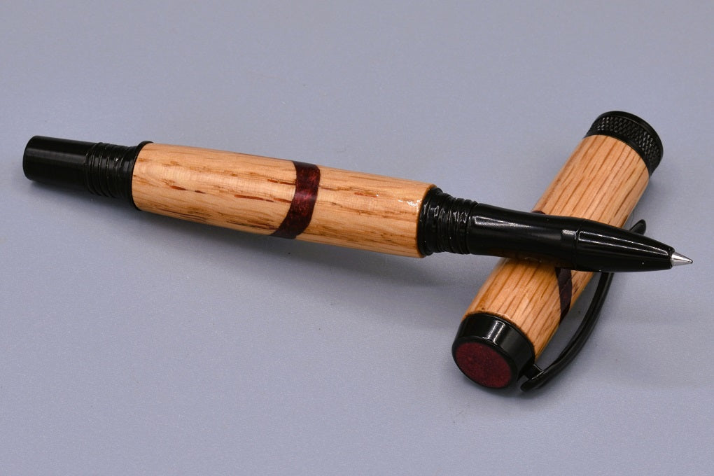 Handmade Knurl rollerball pen. Oak wood and red resin.