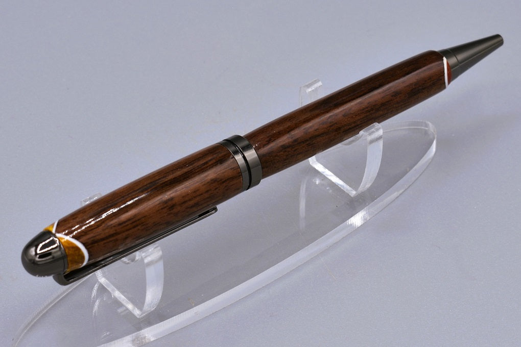 Handmade Round Top twist pen. Walnut, Canary, and Padauk woods.