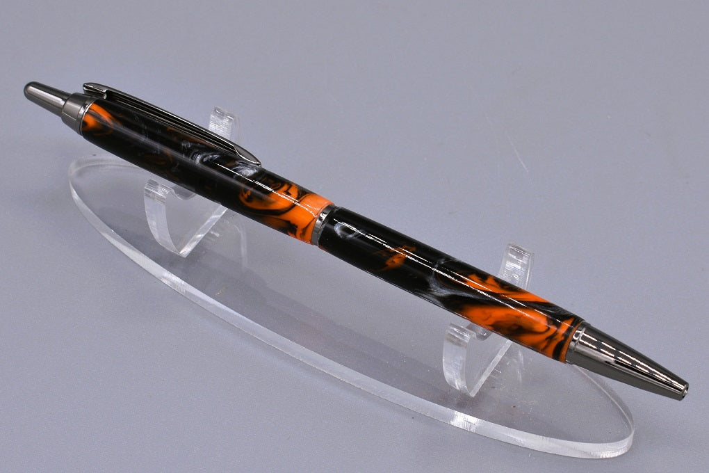 Handmade Slim click pen. Black, orange & silver resin.