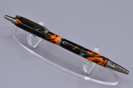 Handmade Slim click pen. Black, orange & silver resin.