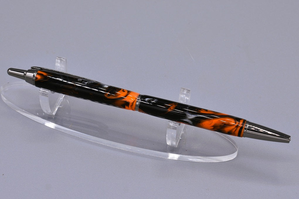 Handmade Slim click pen. Black, orange & silver resin.