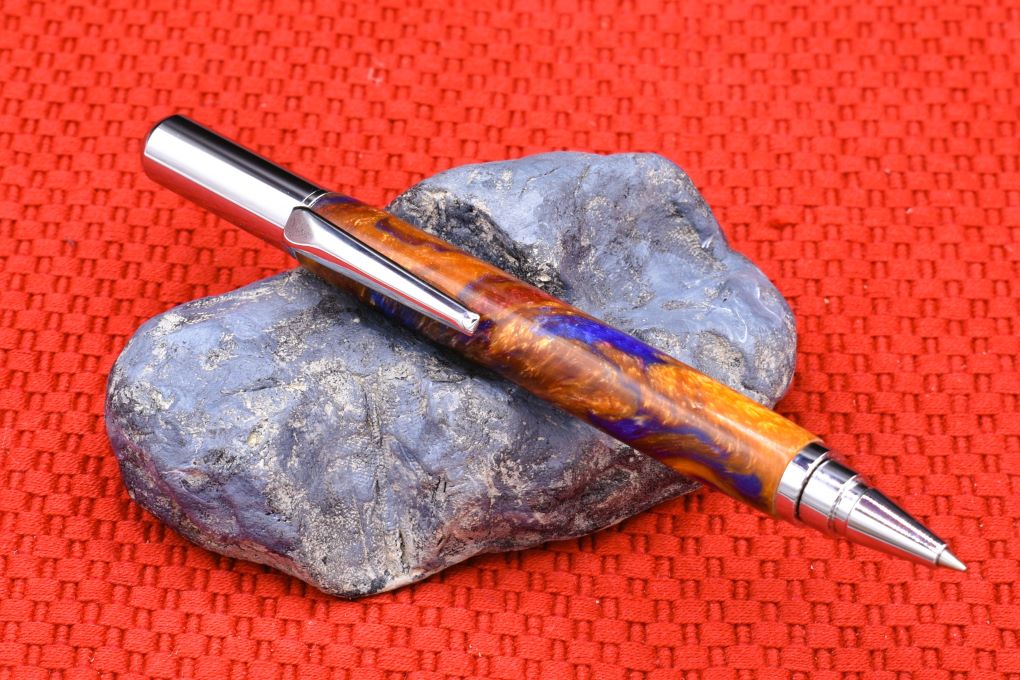 Handmade Chrome capped rollerball pen. Blue, red, Aztec gold resin.