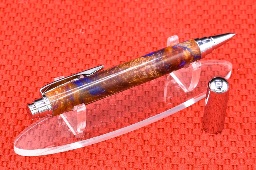 Handmade Chrome capped rollerball pen. Blue, red, Aztec gold resin.