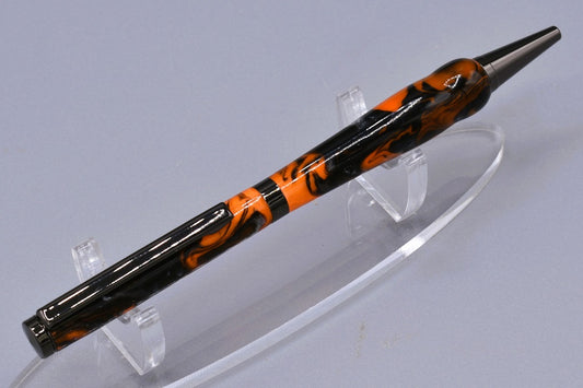 Handmade Slim twist pen. Black, orange, silver resin.