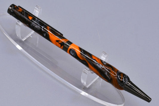 Handmade Slim twist pen. Black, orange, silver resin.