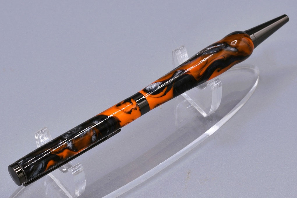 Handmade Slim twist pen. Black, orange, silver resin.
