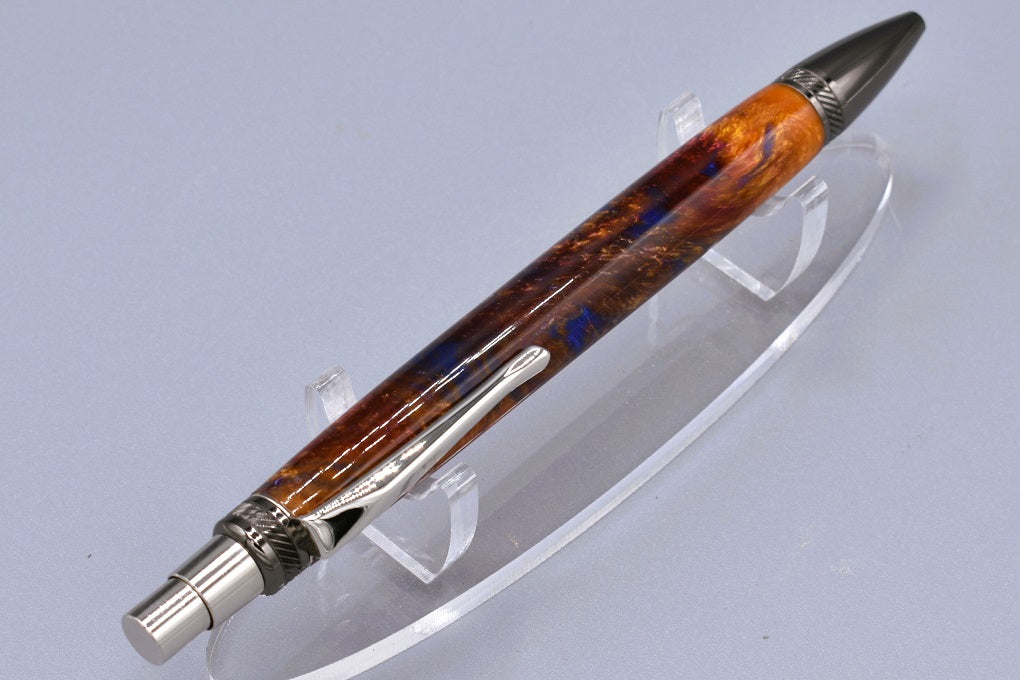Handmade thick click pen. Blue, red, Aztec gold resin.
