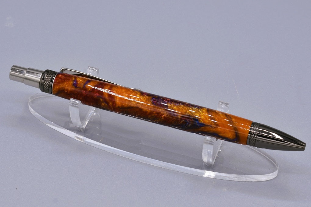 Handmade thick click pen. Blue, red, Aztec gold resin.