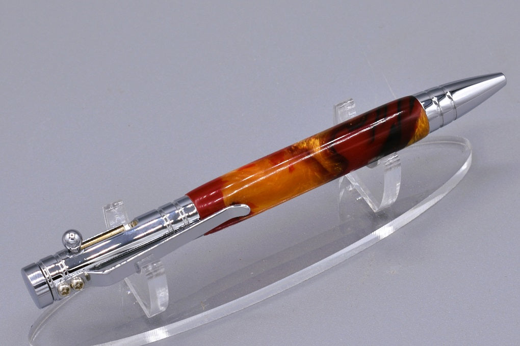 Handmade Bolt Action click pen. Black, red, gold resin.