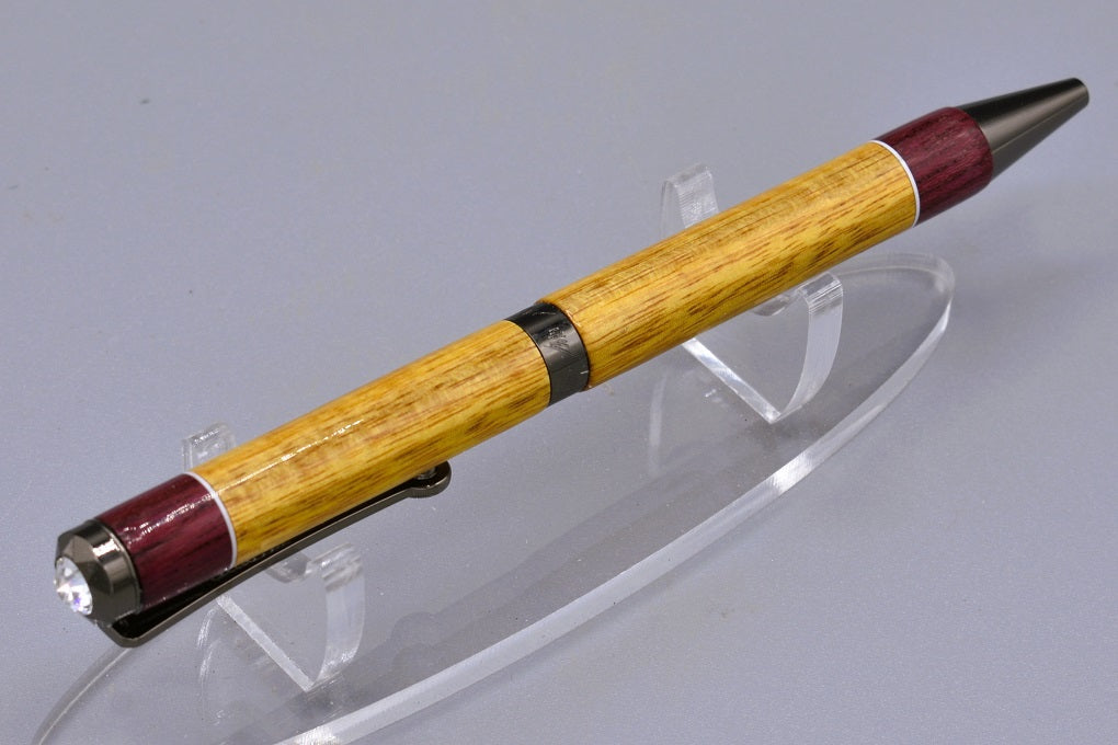 Handmade Diana twist pen. Canary and Purpleheart woods.