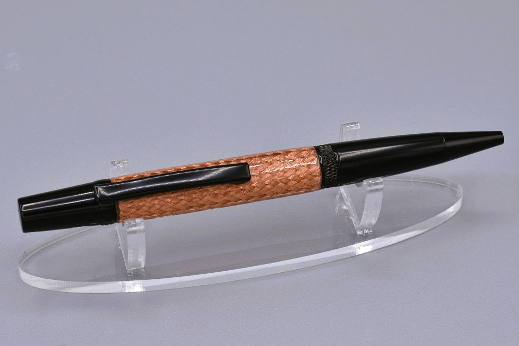 Handmade Knurl twist pen. Braided copper and resin.