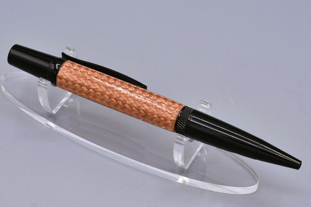 Handmade Knurl twist pen. Braided copper and resin.