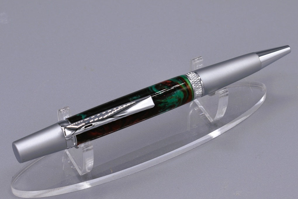 Handmade Knurl twist pen in black, red & teal resin.