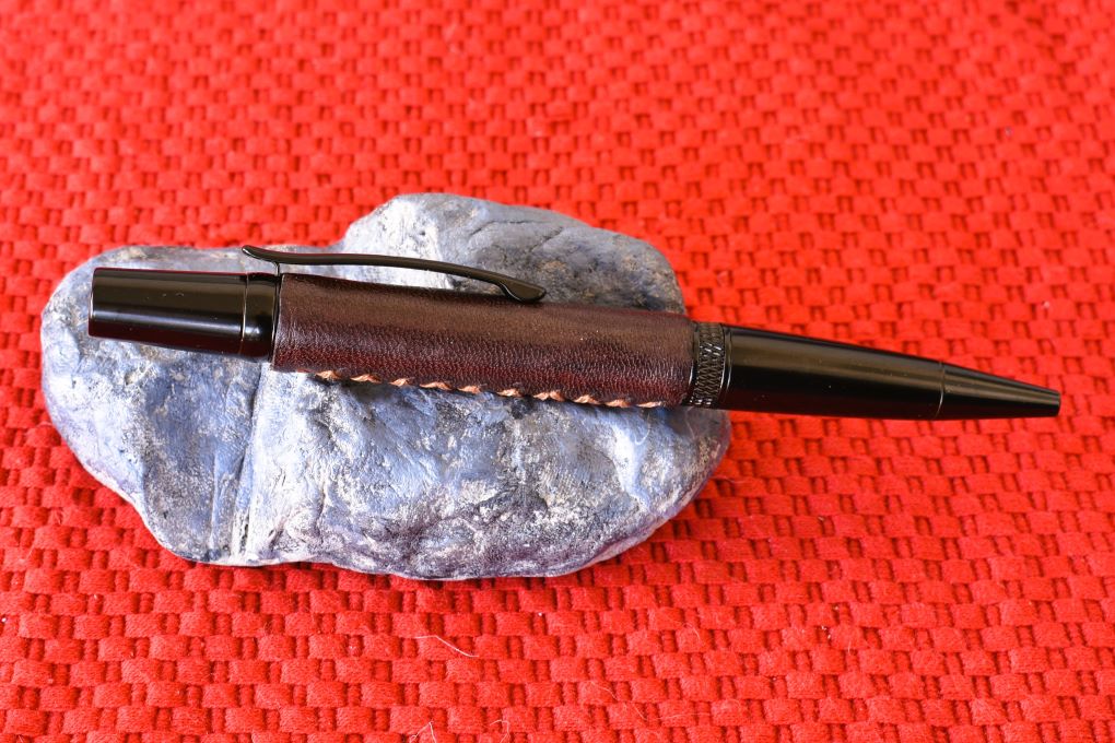 Handmade Knurl twist pen. Dark brown leather.