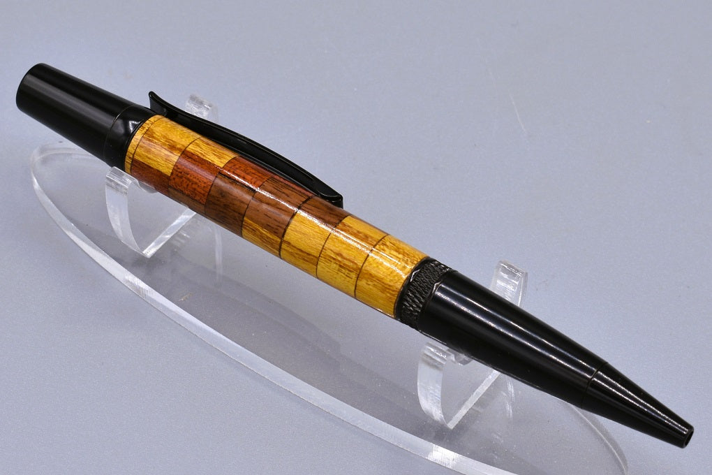 Handmade Knurl twist pen. Mulberry, Granadillo, Padauk woods.