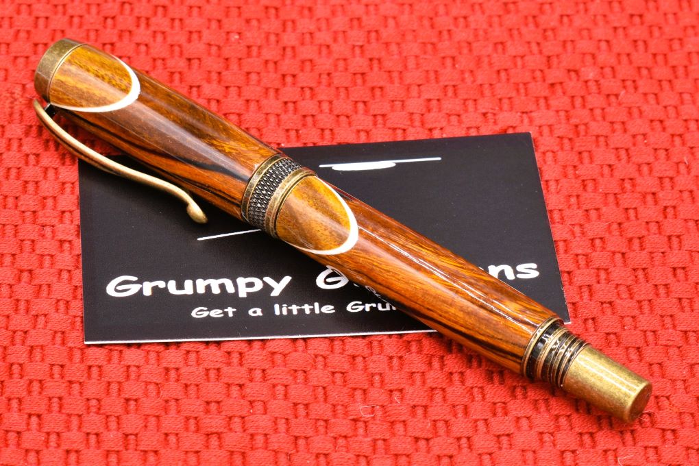 Handmade Knurl rollerball pen. Sonora Desert Ironwood and Canary wood.