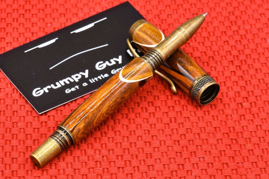 Handmade Knurl rollerball pen. Sonora Desert Ironwood and Canary wood.