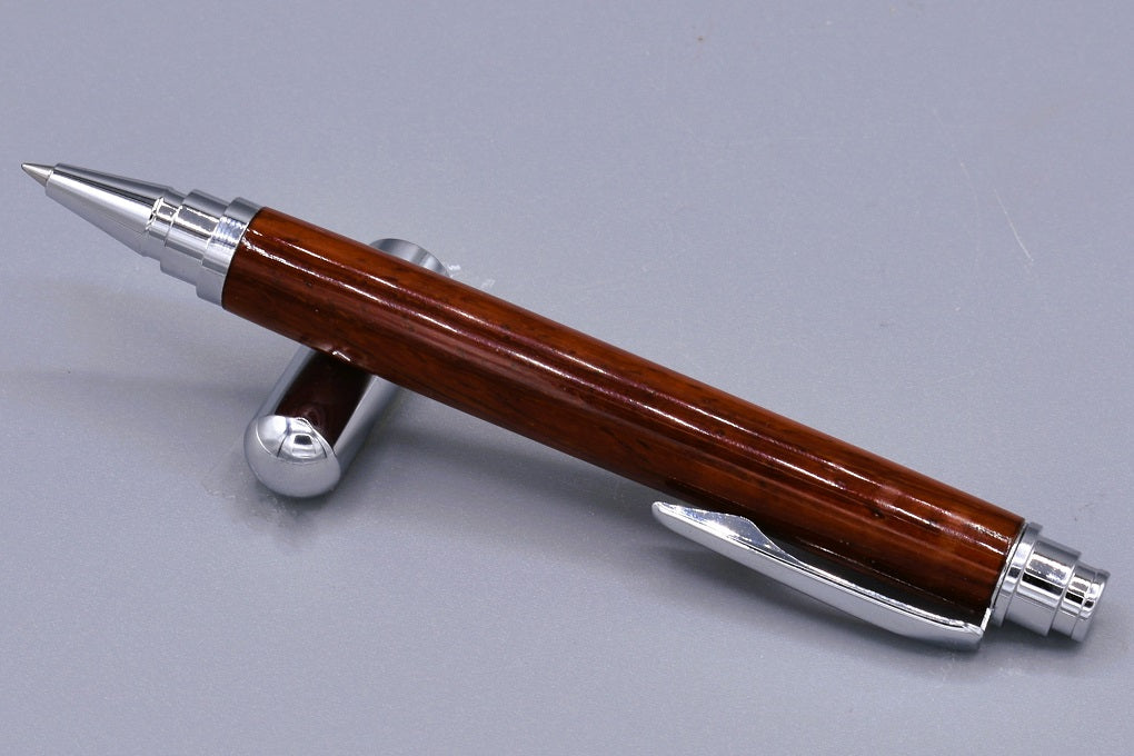 Handmade Chrome capped rollerball pen. Padauk wood.