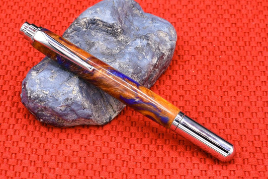 Handmade Chrome capped rollerball pen. Blue, red, Aztec gold resin.