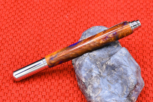 Handmade Chrome capped rollerball pen. Blue, red, Aztec gold resin.